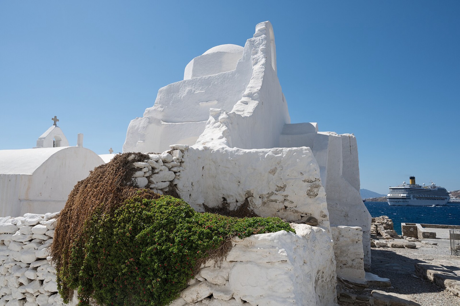The whitewashed bulk of Panagia Paraportiani in the Kastro