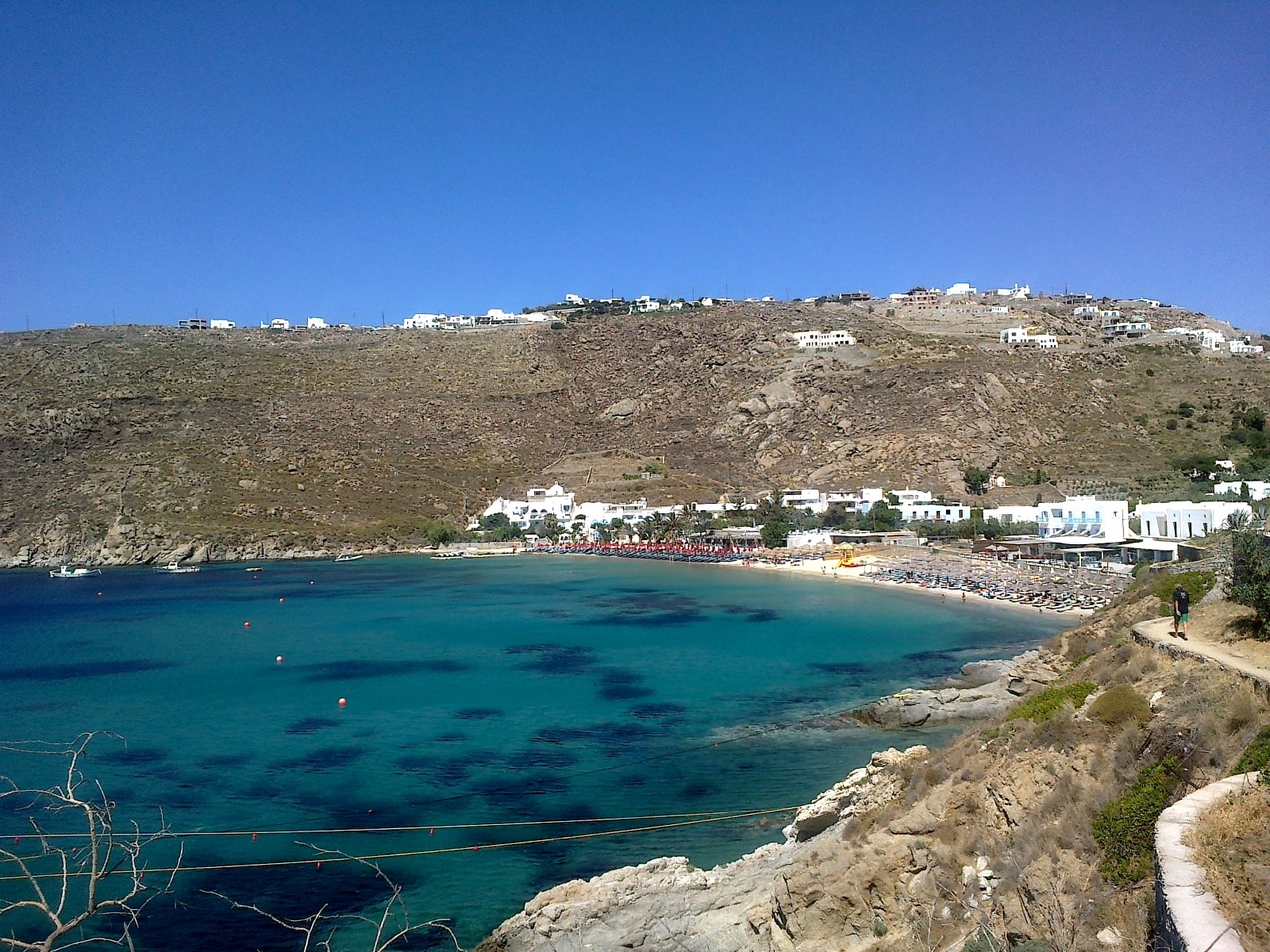 Psarou beach, the cove where Nammos sits